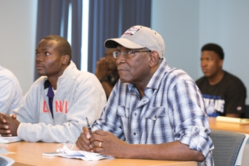 Dr. Hall attending a student forum 