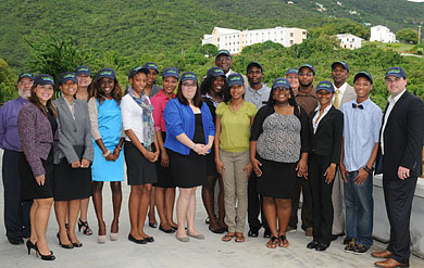 Photo of Wyndham execs presenting check to UVI