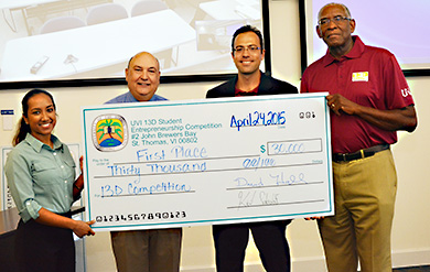 UVI 13D Winner Annalee Peru, 13D Coordinator Dr. Glenn Metts, Jonathan Gula of 13D and UVI President David Hall pose for a photo after the 13D Student Entrepreneurship Competition. 