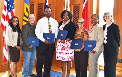 Dr. Marcella Nunez-Smith, Charles Nickerson, Dr. Ken Okolo, Taetia Phillips-Dorsett, Dr. Maxine Nunez, Masserae Sprauve-Webster and Dr. Elizabeth Bradley pose for a photo after the closing ceremonies of the Yale Global Health Leadership Institute Forum for Change