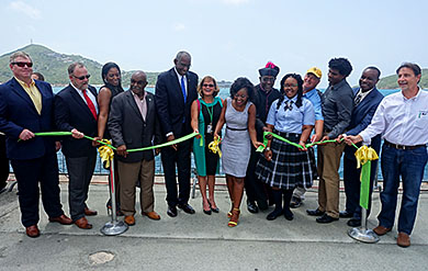 UVI President David Hall and VI Next Generation Network  President and CEO Dr. Tonjia Coverdale participate, along with others, in ribbon cutting ceremony on the Waterfront on St. Thomas. 