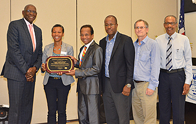 UVI President David Hall presents the President's Appreciation Award to Provost Camille McKayle, Dr. James Maddirala, Henville Pole, Stuart Ketcham and Dr. Frank Mills. 