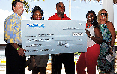 Bryan Dixon, director of Resort Operations for the Caribbean Region, UVI student Tyler Hendrickson and  her parents, and Sarah King, executive vice president of Human Resources for Wyndham, pose for a photo after a scholarship presentation at Wyndham Margaritaville. 