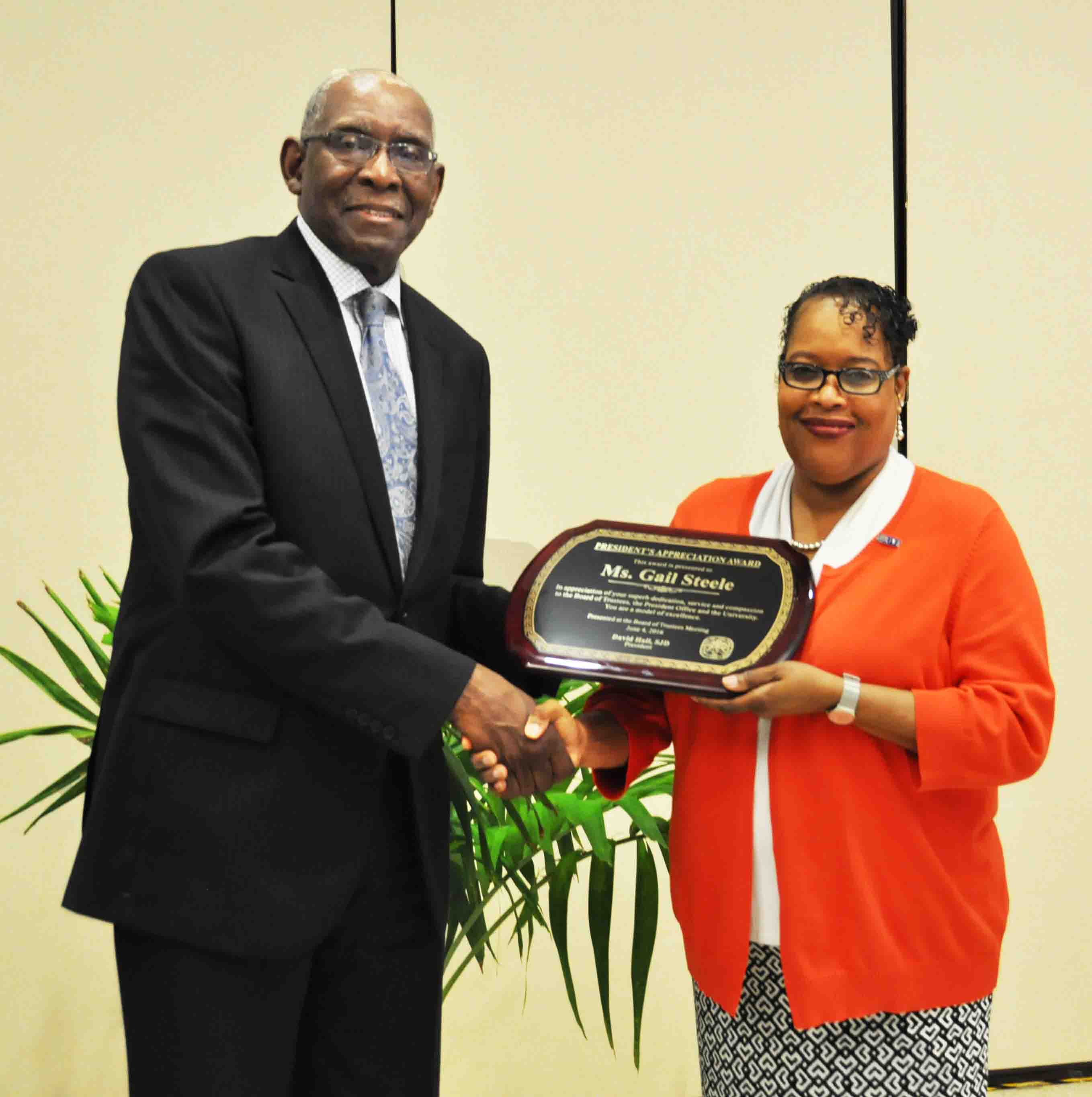 Gail Steel accepts award from President David Hall