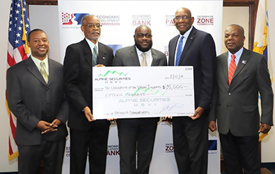 UVI Vice President of Institutional Advancement Mitchell Neaves, EDA Chairman of the Board Jose Penn, Chief of External Affairs at Alpine Securities Jason Charles, UVI President David Hall and EDA Director of Administration and Finance Ernest Halliday pose for photo at a check presentation held at the EDAs Nisky Center Offices