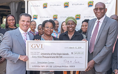 Greenleaf VI Owner Philip Arcidi presents UVI President David Hall with check