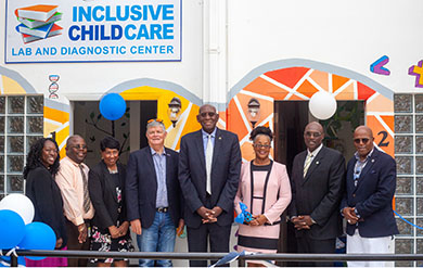 D. Karen Brown, Avery Lewis, Dr. Linda Thomas, Board Chairman Henry Smock, UVI President David Hall, Childcare Diagnostic Center Director Sherryl Tonge George, Senate President Novelle Francis and Sen Myron Jackson pose for photos in front of the Inclusive Childcare Laboratory and Diagnostic Center