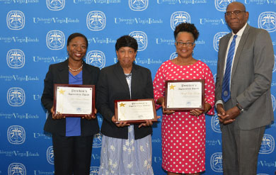 Dr Karen Brown, Dr Linda Smith and Sherryl Tonge George accept a Presidential Appreciation Award from UVI President David Hall