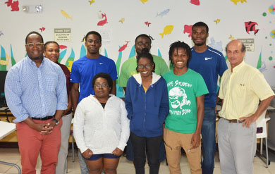 computer science students and professors pose for group photo