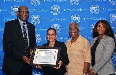 UVI President David Hall presents President Appreciation Award at Board of Trustees Meeting to Nereida Washington, Marlene Thomas and Una Dyer